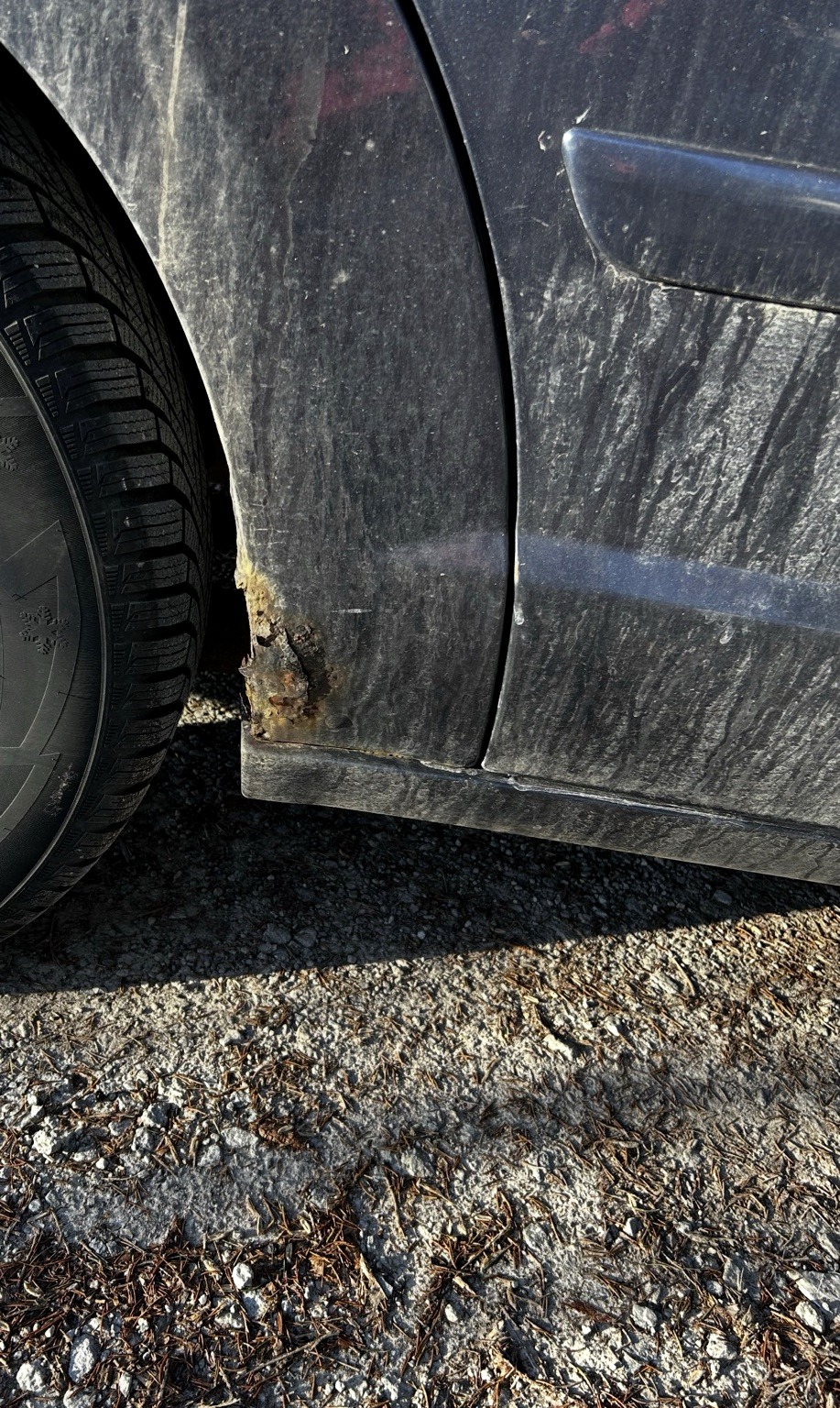 Before rust repair on lower front fender